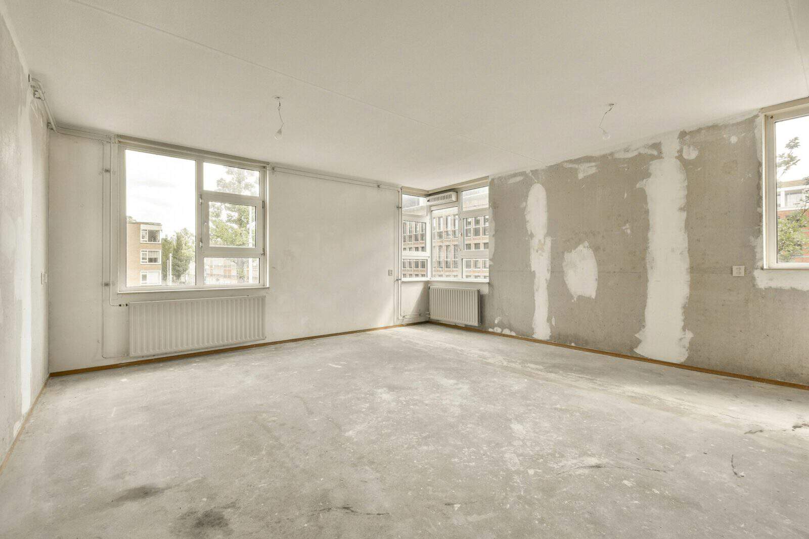 an empty room in a building with plaster on the
